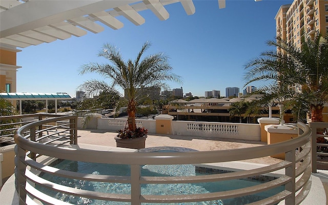 view of patio with a balcony and a pergola