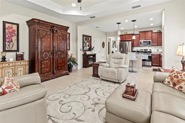 living area featuring ceiling fan, visible vents, and recessed lighting