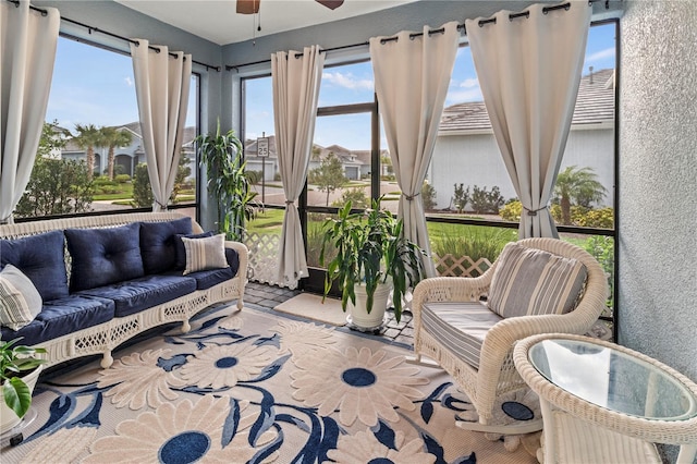 sunroom featuring ceiling fan