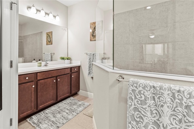 bathroom featuring tile patterned floors, walk in shower, and vanity