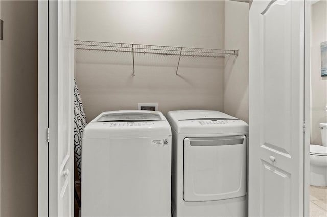 laundry area featuring laundry area and washer and clothes dryer