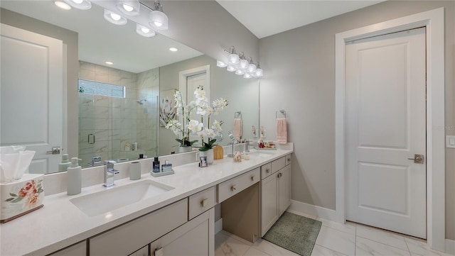 full bathroom featuring a stall shower, a sink, baseboards, and double vanity