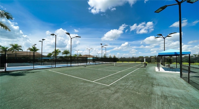 view of sport court featuring fence