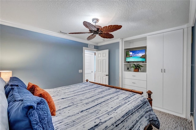 carpeted bedroom featuring visible vents, crown molding, a textured ceiling, and ceiling fan