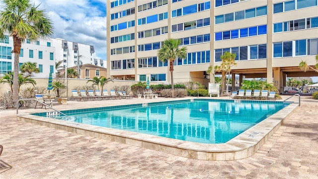 view of swimming pool with a patio