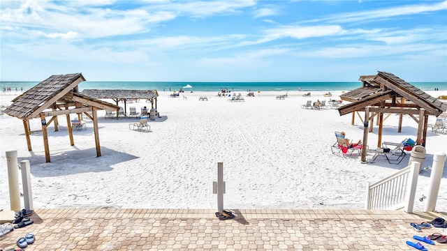 property view of water with a gazebo and a beach view