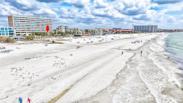 aerial view featuring a view of city, a water view, and a beach view