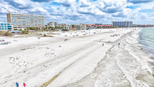 aerial view with a water view, a view of the beach, and a city view