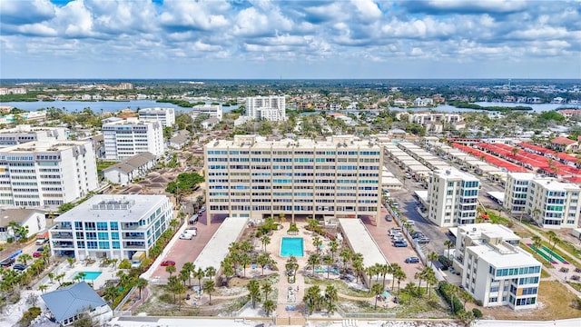 drone / aerial view featuring a water view and a city view