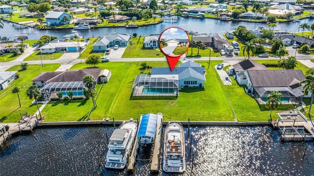 bird's eye view with a water view and a residential view