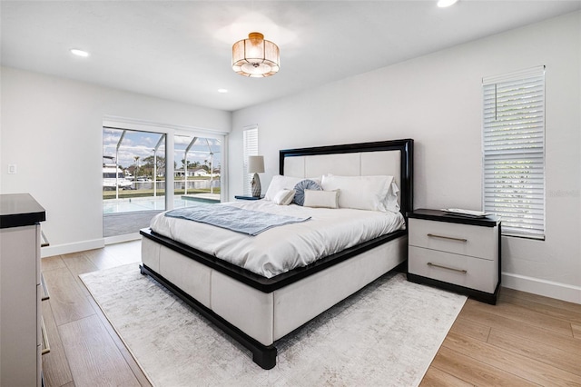 bedroom featuring light wood finished floors, recessed lighting, and baseboards