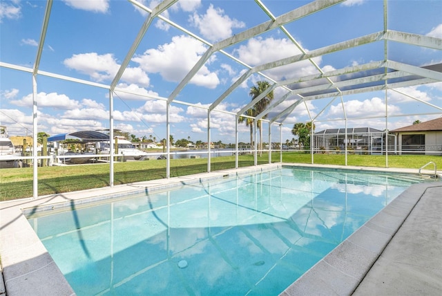 pool with glass enclosure and a lawn