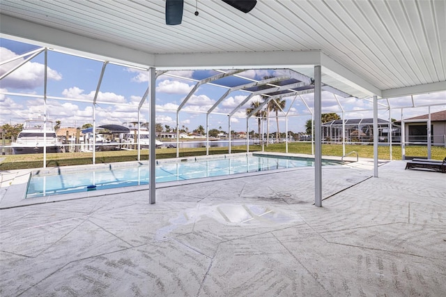 pool with a lanai and a patio area