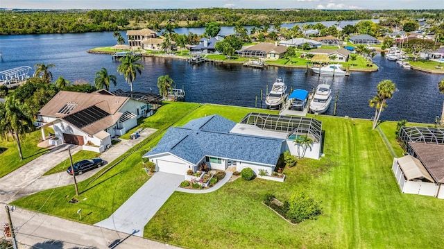 birds eye view of property with a residential view and a water view