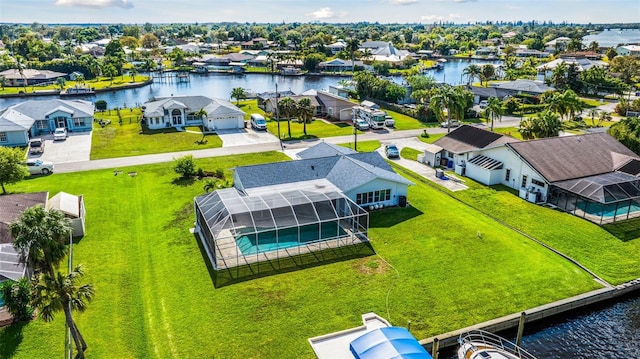 drone / aerial view featuring a water view and a residential view