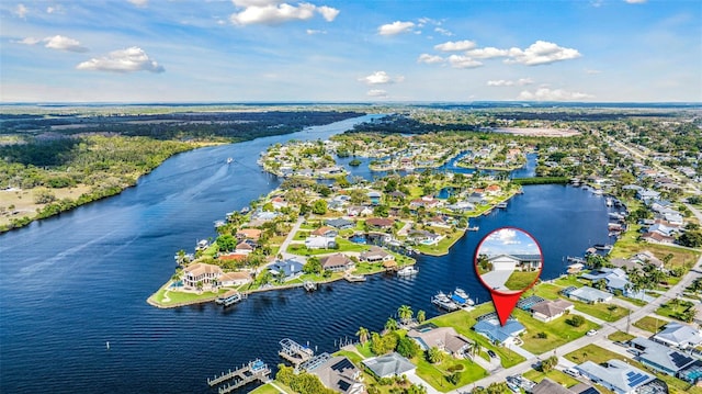 drone / aerial view featuring a residential view and a water view