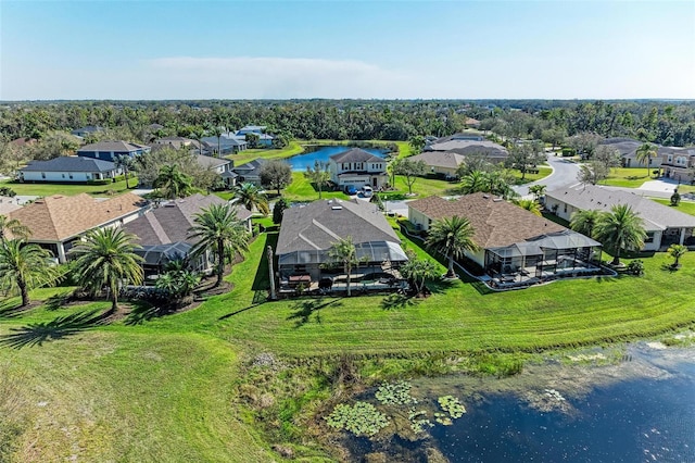 drone / aerial view with a residential view and a water view