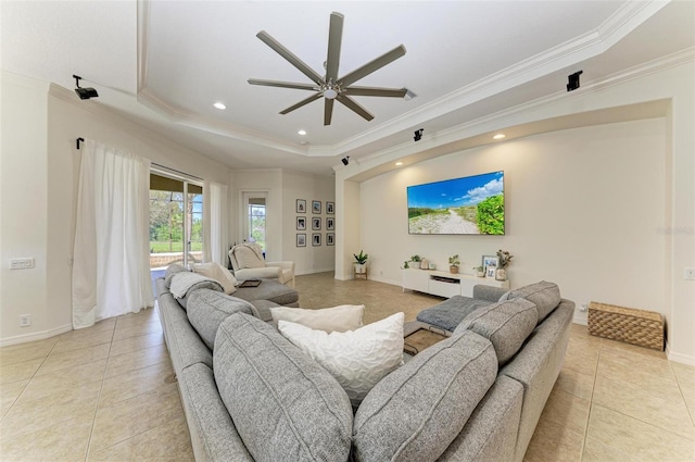 living room featuring ornamental molding, recessed lighting, a raised ceiling, and light tile patterned floors