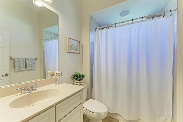 full bath featuring toilet, a shower with shower curtain, and vanity