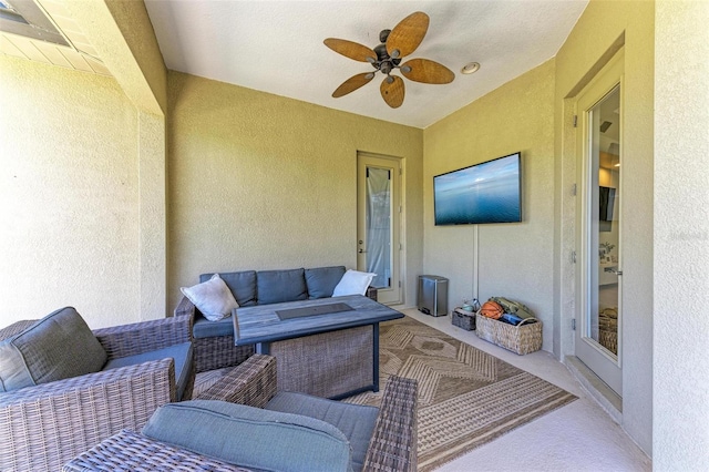 view of patio with an outdoor hangout area and a ceiling fan