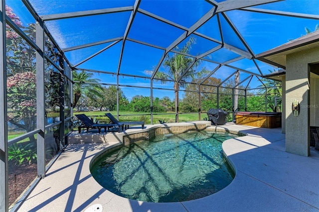 pool with a lanai, a grill, a patio, and a hot tub