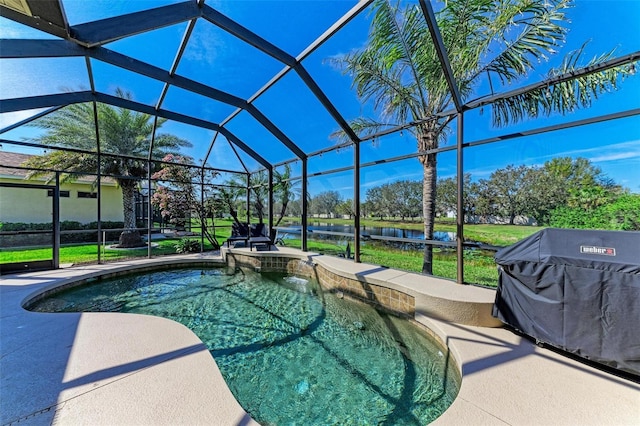 outdoor pool featuring a lanai, a patio area, and a grill