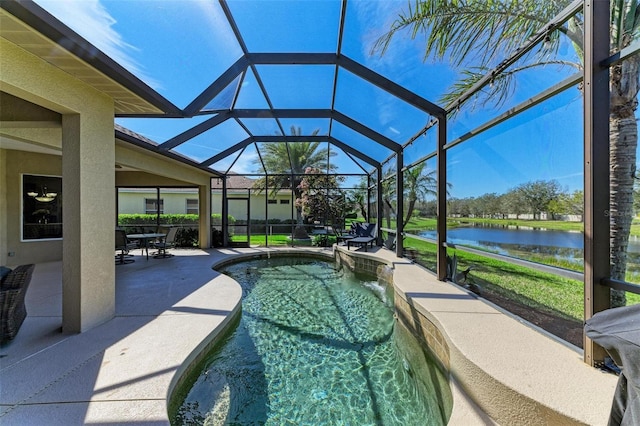 outdoor pool with a lanai, a water view, and a patio