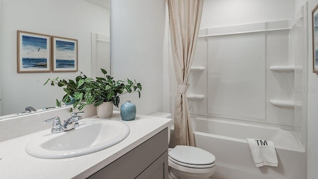 bathroom with vanity, toilet, and shower / bath combo with shower curtain