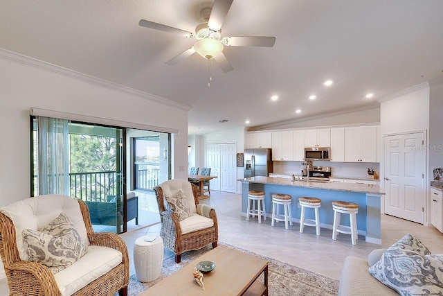 living room featuring ornamental molding, recessed lighting, light tile patterned floors, lofted ceiling, and ceiling fan