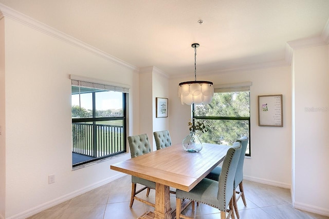 dining room with light tile patterned floors, baseboards, and ornamental molding