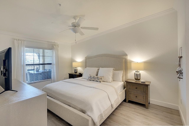 bedroom with ceiling fan, light wood-type flooring, baseboards, and ornamental molding