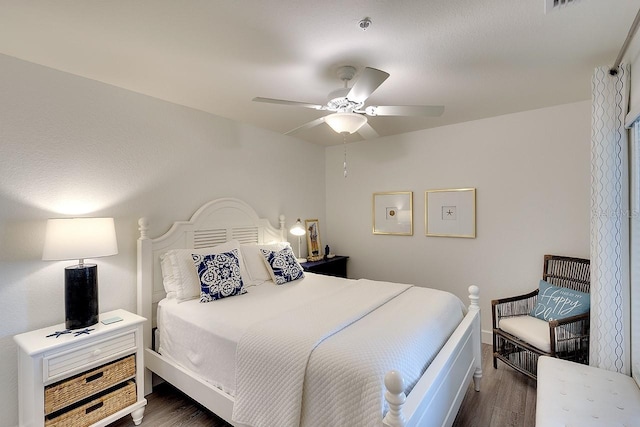 bedroom featuring a ceiling fan and wood finished floors