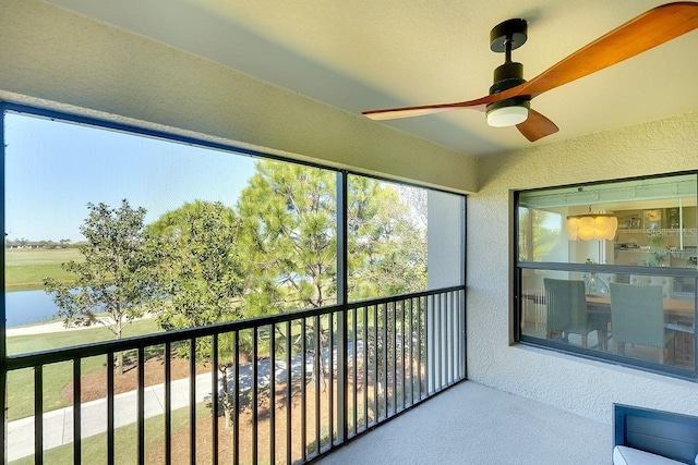 sunroom featuring plenty of natural light and ceiling fan