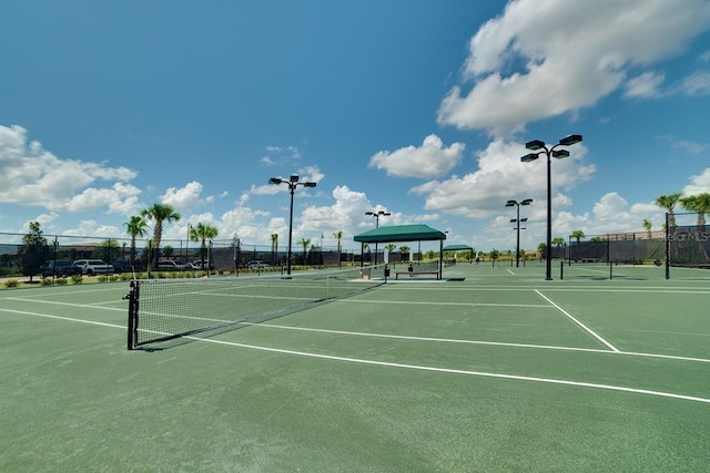 view of tennis court with fence