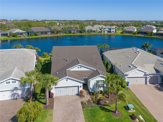 aerial view with a residential view and a water view