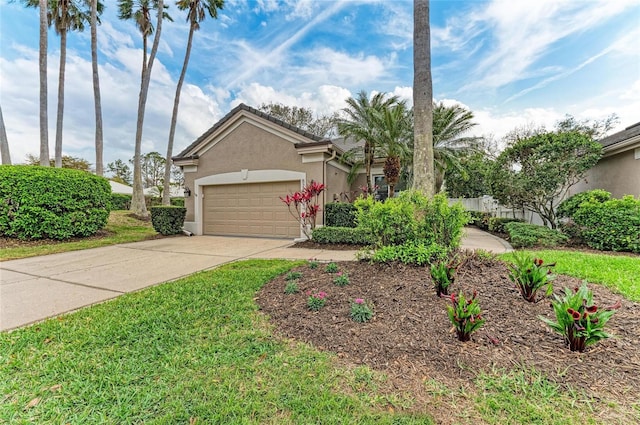 view of front of home featuring a garage, concrete driveway, and stucco siding