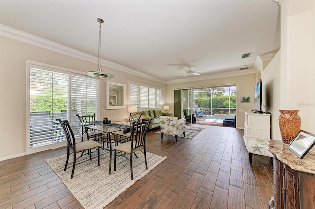 dining room with crown molding, a ceiling fan, a sunroom, and wood tiled floor