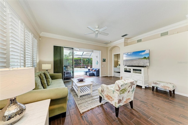 living room featuring visible vents, ornamental molding, dark wood-style floors, and a sunroom