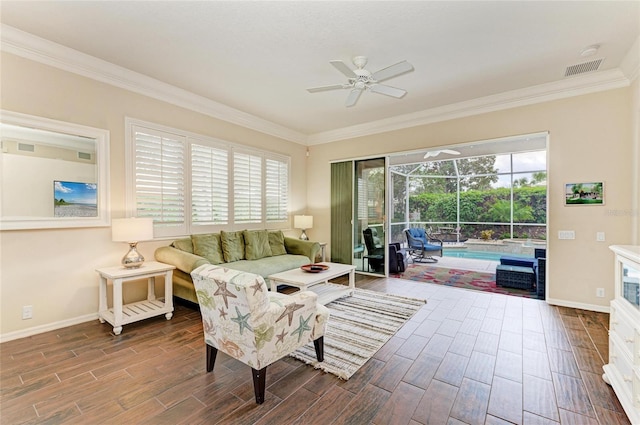 living area featuring a sunroom, wood tiled floor, baseboards, and ceiling fan