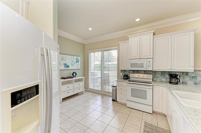 kitchen with ornamental molding, white appliances, light countertops, and backsplash