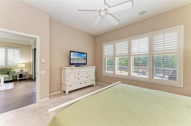 unfurnished bedroom with a ceiling fan, carpet, visible vents, and baseboards