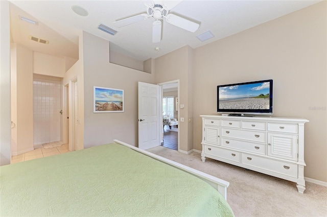 bedroom featuring baseboards, visible vents, and light colored carpet