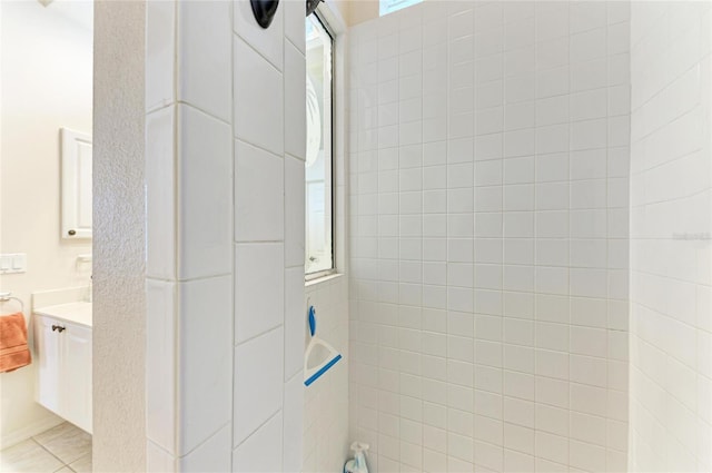 full bathroom with a shower, vanity, and tile patterned floors