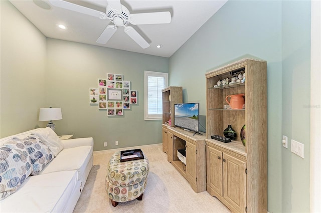 living area featuring recessed lighting, ceiling fan, baseboards, and light colored carpet