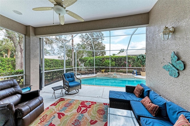 exterior space with a fenced in pool, glass enclosure, a patio area, ceiling fan, and an in ground hot tub