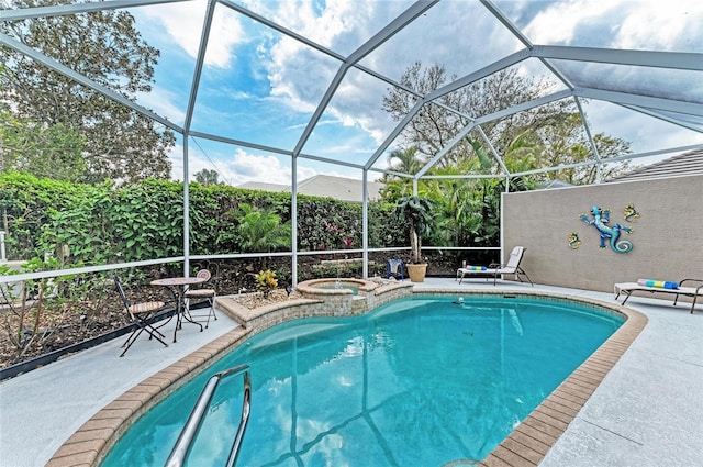 outdoor pool with an in ground hot tub, glass enclosure, and a patio