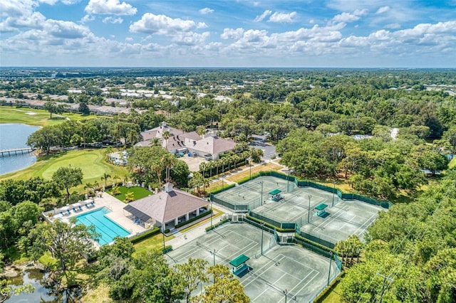 bird's eye view with a water view and view of golf course