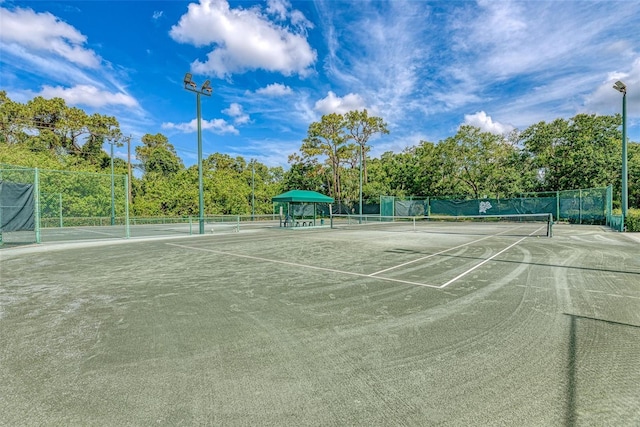 view of sport court with fence