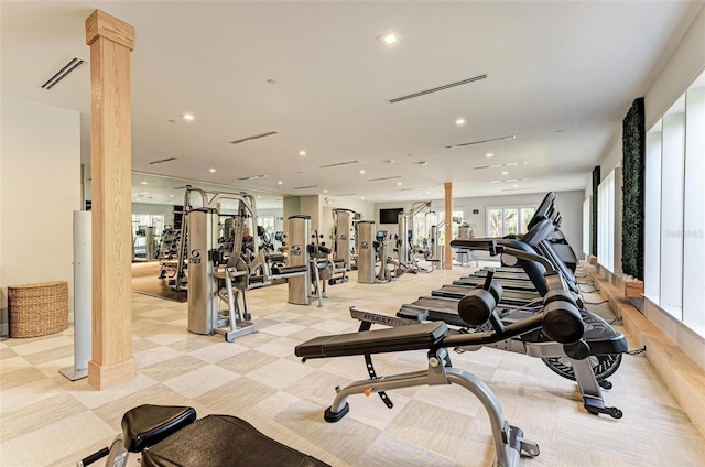 workout area featuring visible vents, decorative columns, and recessed lighting