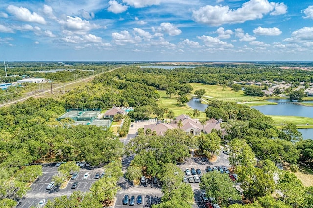 aerial view featuring golf course view and a water view